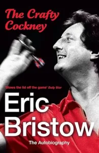 Crafty Cockney smile and dart throw